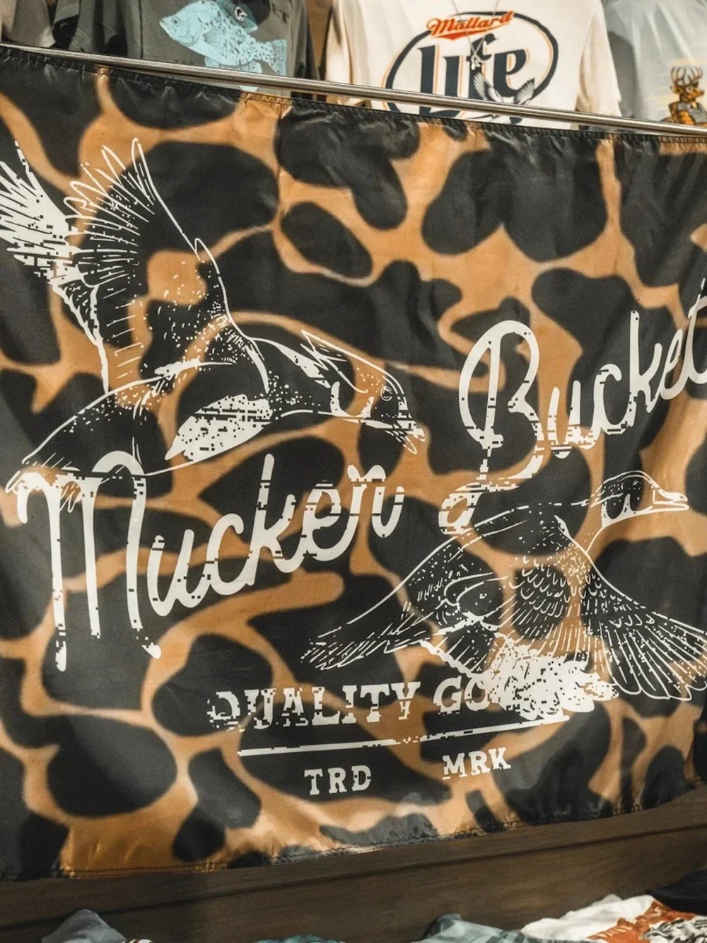 Mucker Bucket Camouflage Wall Tapestry in Tan & Black